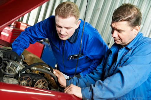 two Omaha mechanics working on auto repairs